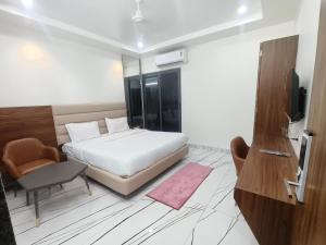 Arihant Hotel客房内的一张或多张床位