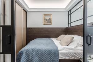 Posteľ alebo postele v izbe v ubytovaní Rent like home - Apartamenty w Deo Plaza