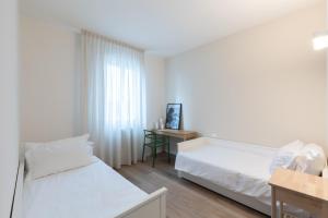 Ένα ή περισσότερα κρεβάτια σε δωμάτιο στο Luxury Suites Collection - Ceccarini 60