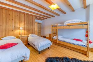 Ένα ή περισσότερα κρεβάτια σε δωμάτιο στο Chalet Belledonne