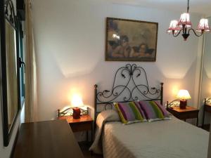 Postel nebo postele na pokoji v ubytování Apartamentos Vacacionales Atlanterra
