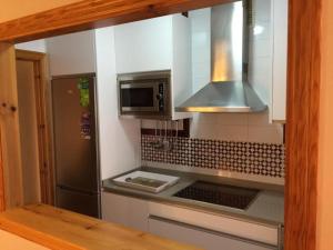 Kuchyň nebo kuchyňský kout v ubytování Apartamentos Vacacionales Atlanterra