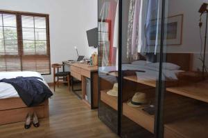 A bed or beds in a room at Rumanami Residence