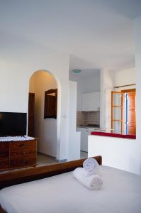 A bed or beds in a room at Moonlight Kastraki beach house