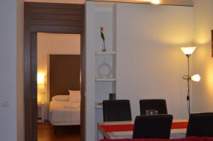 Posteľ alebo postele v izbe v ubytovaní Apartamentos Coronado