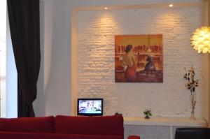 Televízia a/alebo spoločenská miestnosť v ubytovaní Apartamentos Coronado
