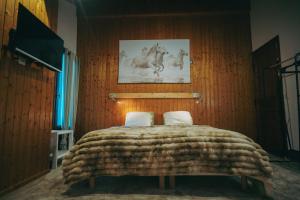 Postel nebo postele na pokoji v ubytování Auberge chez Mado et Augusta