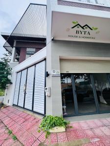 a building with the entrance to a house and hospitality at Homestay Byta House in Kinh Dinh