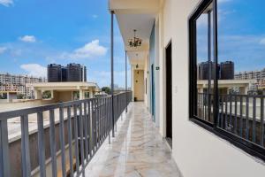 a balcony with a view of the city at Hotel O Hosur Road Near PES University in Bangalore