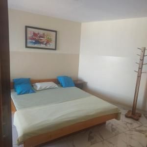 Voodi või voodid majutusasutuse Oia Mindelo Chambre d'hotes toas