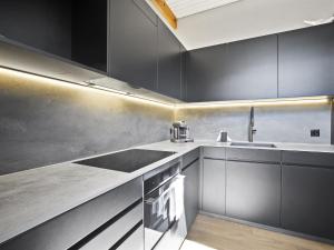 Kuchyň nebo kuchyňský kout v ubytování Apartment Honegger by Interhome