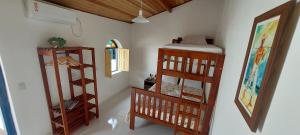 a room with two bunk beds in a room at Pousada Athena in Palmeiras