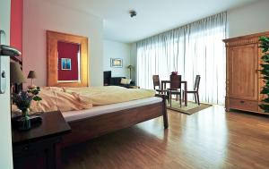 Postel nebo postele na pokoji v ubytování Heldts Aparthotel