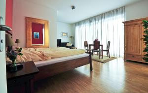 מיטה או מיטות בחדר ב-Heldts Aparthotel