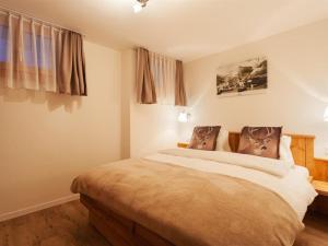 Ένα ή περισσότερα κρεβάτια σε δωμάτιο στο Apartment Apartment Bristolino by Interhome