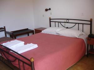 Postel nebo postele na pokoji v ubytování Hotel Inomaos