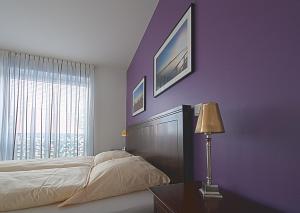 Postel nebo postele na pokoji v ubytování Heldts Aparthotel