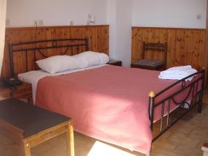 Postel nebo postele na pokoji v ubytování Hotel Inomaos