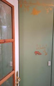 a door with a picture of a frog on the wall at Apartment Leopold mit Balkon in Coburg