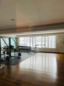 a large room with a gym with treadmills and benches at Seri Bukit Ceylon Suites Bukit Bintang in Kuala Lumpur +29 photos
