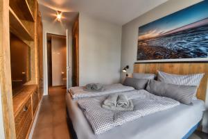 Postel nebo postele na pokoji v ubytování Ferienwohnung Horizonte-Loft in der Villa Martha Binz