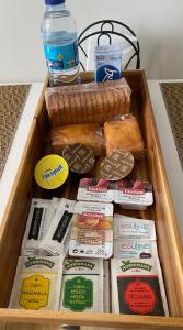 a wooden box filled with different types of food at Apartamentos Buenos Aires,en el centro de Ribadeo con vistas a la ría in Ribadeo