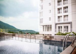 a pool of water in front of a building at Deluxe and Cozy 2BR Apartment at Skyland City Jatinangor By Travelio in Sumedang