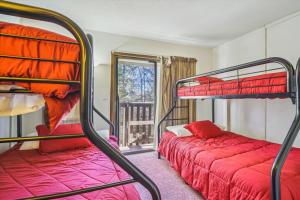 a bedroom with two bunk beds and a window at Hemlock Ridge 6A in Killington