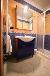a bathroom with a sink and a shower at Residence Beach Paradise in Rimini +63 photos