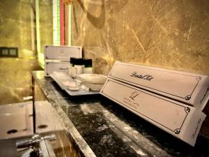 a bathroom with two toasters on a counter at Hotel Lata Continental in Kānpur