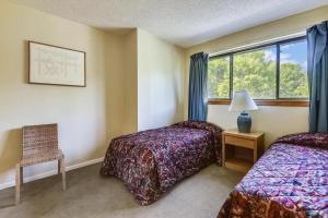 a hotel room with two beds and a window at Pinnacle F21 in Killington +60 photos