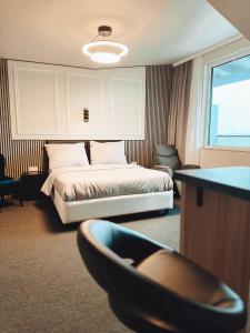 A bed or beds in a room at F Hotel 24h Check-In