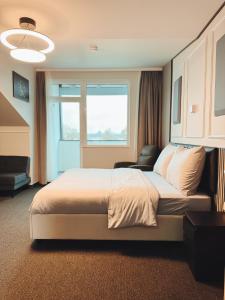 A bed or beds in a room at F Hotel 24h Check-In