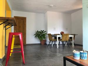 a dining room with a table and chairs at Hostel La Fanega in Alora