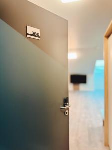 A television and/or entertainment centre at F Hotel 24h Check-In