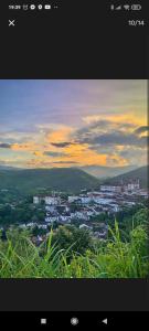 a view of a city with buildings in the distance at Hostel do Mirante in Ouro Preto +29 photos