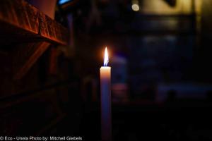 a candle is lit in a dark room at Experience accommadation Eco-Unela in Rovaniemi