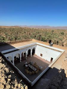 an aerial view of a house in the middle of a field at Riad bounaylat in Toug er Rih