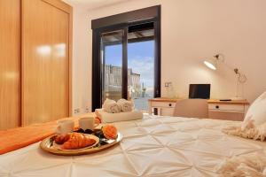 En eller flere senge i et værelse på Casa Bonita Lajares 3 + 27 billeder