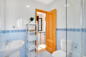 a bathroom with a sink and a toilet and a shower at Casa Bonita Lajares Fuerteventura in Lajares +37 photos