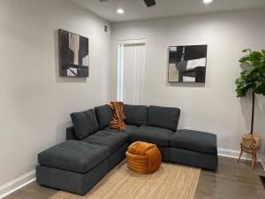 a living room with a blue couch in a room at Mixed Rustic Vibes in Chicago