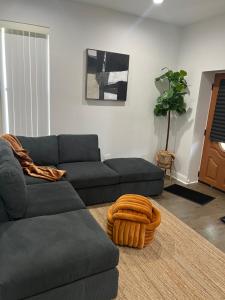 a living room with a couch and a table at Mixed Rustic Vibes in Chicago