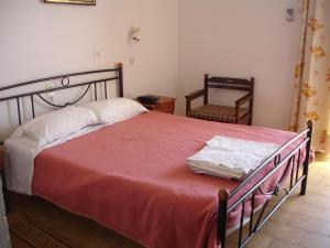 Postel nebo postele na pokoji v ubytování Hotel Inomaos