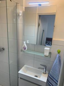 Et badeværelse på Lerose Apartman