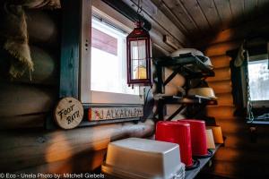 a small room with a window and a table with a toilet at Experience accommadation Eco-Unela in Rovaniemi +36 photos