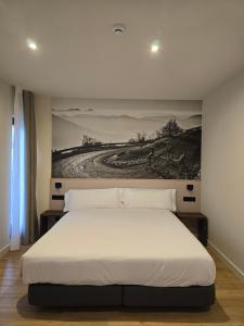 Voodi või voodid majutusasutuse Hotel Llivia toas