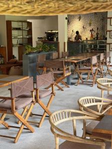 a group of tables and chairs in a restaurant at The Green Door in Ella