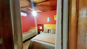 Cama ou camas em um quarto em Chalés Guigó-Cumuruxatiba, sossego e privacidade