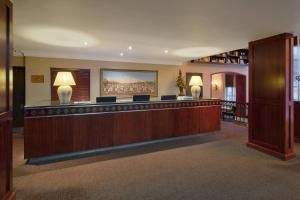 a lobby with a bar in a hotel at Protea Hotel by Marriott Blantyre Ryalls in Blantyre +56 photos