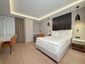 Postel nebo postele na pokoji v ubytování Dedeman Adana
